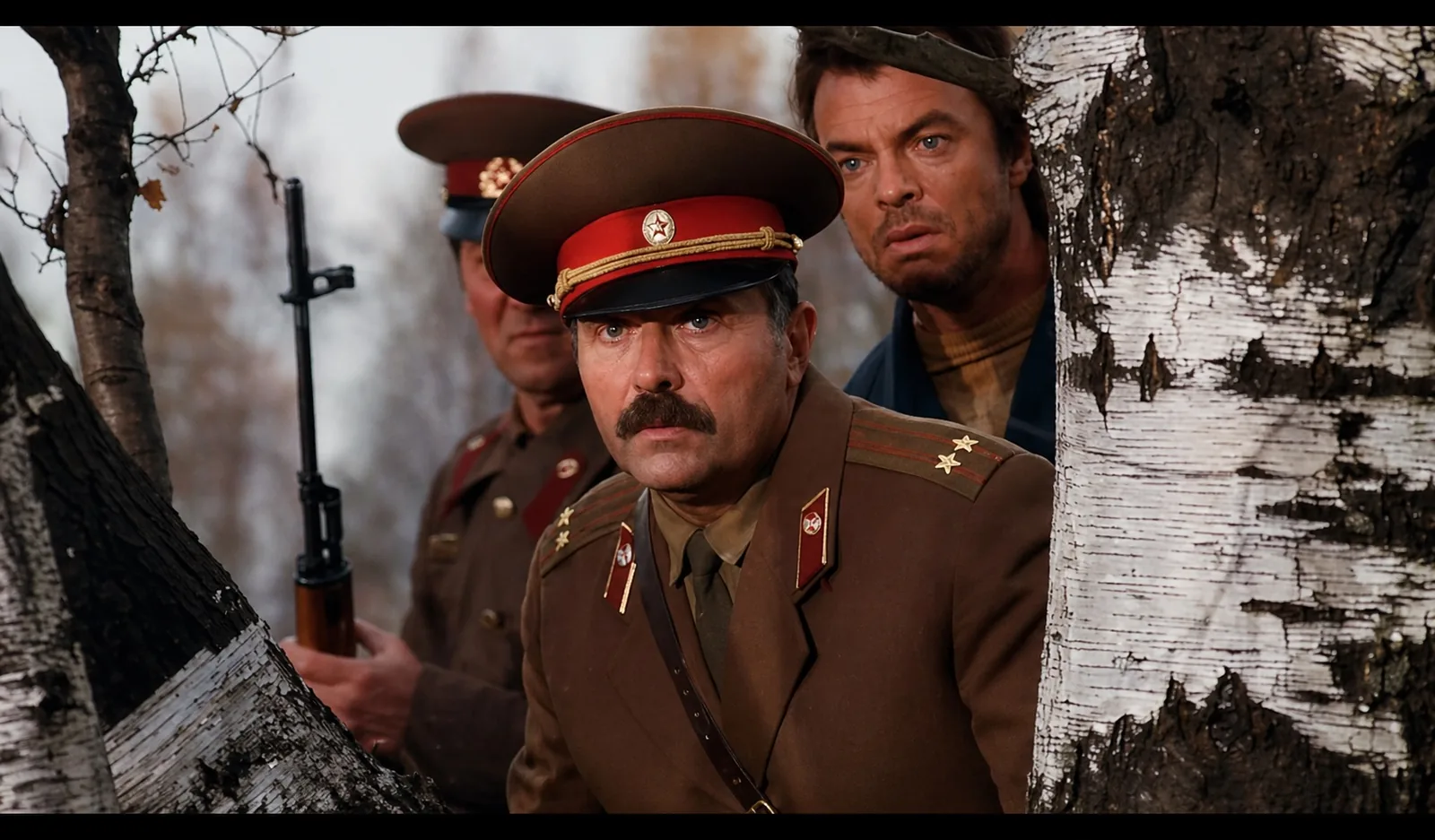 Kolya and Jeffrey West tracking Petrov in the wilderness
